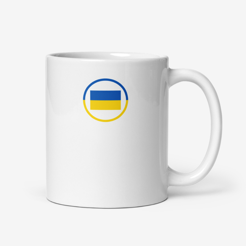 Mug blanc avec drapeau ukrainien Mug en céramique blanc vu de face avec un motif circulaire bleu et jaune représentant le drapeau ukrainien.